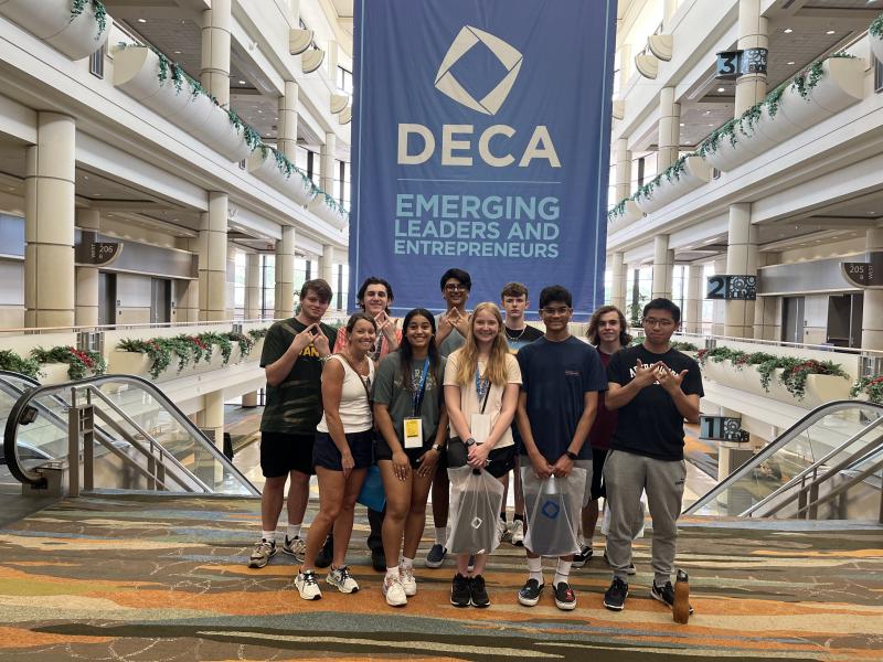 The Cape High DECA group joined 20,000 high school students, advisors, business professionals and alumni for the annual conference. Gathered are in back (l-r) Wiley Owens, Andrew Racz, Sahil Patel, Will Powell and Jacob Mclean. In front are Cape High business and marketing teacher and DECA advisor Kristen Jones, Sia Patel, Kathryn Costello, Krish Prattipati and Jia Qi Xie.